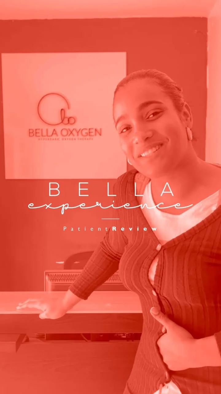 Patient at the Bella Oxygen reception desk in front of the clinic logo sign
